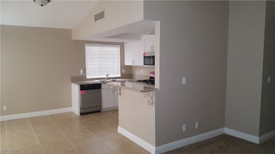 Kitchen featuring appliances with stainless steel