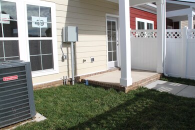 The back courtyard and covered porch.  Similar home.