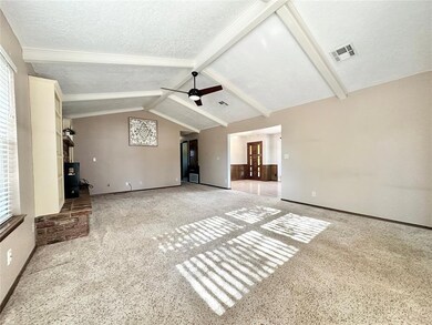 Unfurnished living room with ceiling fan, light ca