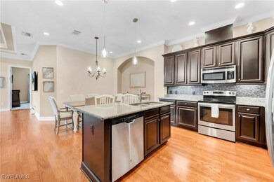 Spacious open-concept kitchen featuring upgraded w