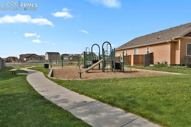 Neighborhood playground with walking trails, benches, tables just one house away.