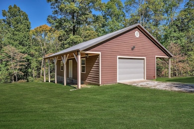 HARD TO FIND UNDER $600,000 in Burns!!!! RECENTLY ADDED 40x24 DREAM Garage/Workshop Electricity in Place + Stubbed for Plumbing Green Grass Edits on Exterior Photos