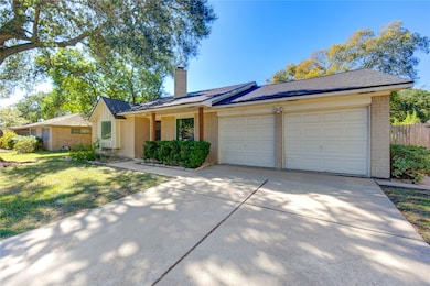 Two car garage with double-wide driveway for extra parking.