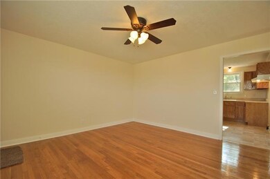 View of den facing kitchen.  All light fixtures and hardware has been upgraded.