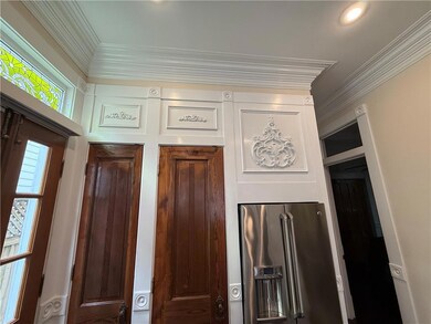 Intricate ornamental detail, 8' solid wood doors
