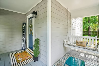 Property entrance with covered porch