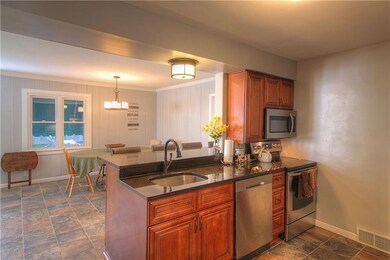 Stainless steel appliances and open to the eating 