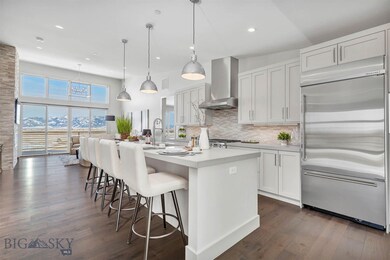 Similar model, gourmet kitchen opens to living are