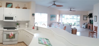 Kitchen to lanai -- beautiful newer Granite Counte
