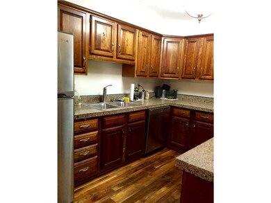 Kitchen. Eat-in kitchen has raised panel wood cabi