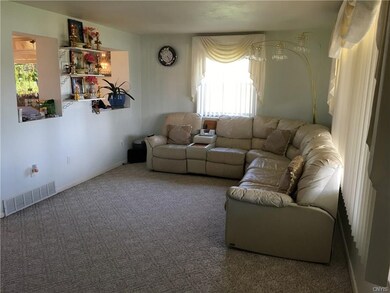 Good sized family room with cutouts to dining room