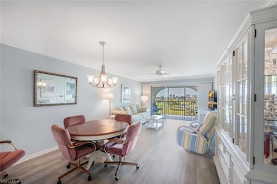 Dining area featuring ceiling fan with notable cha