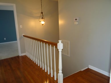Beautiful Hardwood floors in upstairs hallway and steps