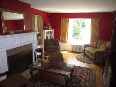 Living Room Gas fireplace and hardwood floors in t
