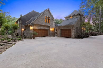 Three car garage with wooden garage doors lots of extra parking space easy to turn around