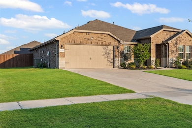 Ranch-style home featuring brick siding, an attached garage, driveway, and roof with shingles