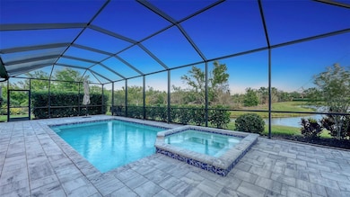 View of the pool/spa, water, and south east sky just after sunset