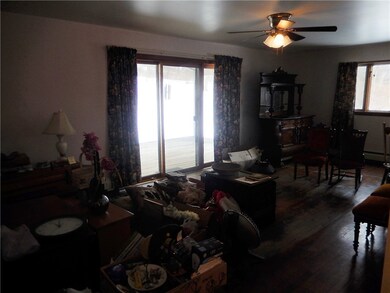 Large living area with hardwood floors throughout