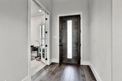 View of the front door from the Kitchen