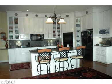 Kitchen - Kitchen island with granite countertop