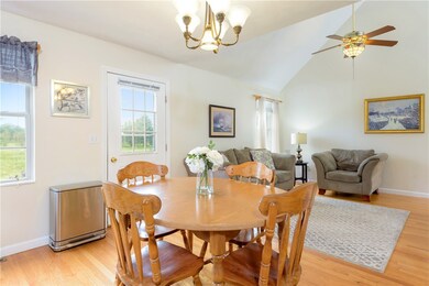Kitchen opens to living room and door leads to rea