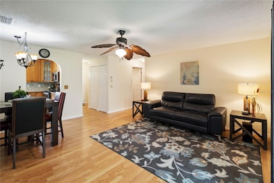 Living space with access to kitchen, foyer and bedrooms