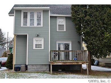 Exterior Back Second story enclosed porch and a de