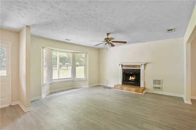 Unfurnished living room with wood finished floors,