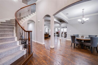 Sweeping staircase welcomes you into the home and 