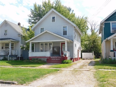 American foursquare style home featuring a porch
