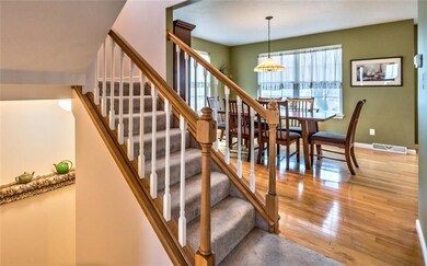 stair way to view of dining open to kitchen