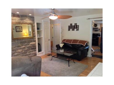 Living Room. Maple h/w floors in a comforting livi