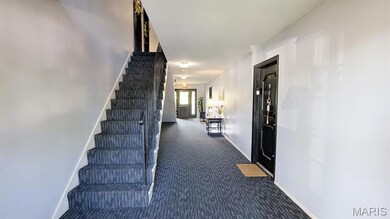 Stairway with carpet floors and baseboards