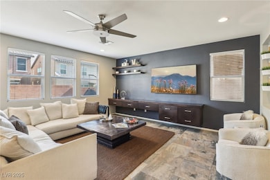 Living area with ceiling fan and recessed lighting