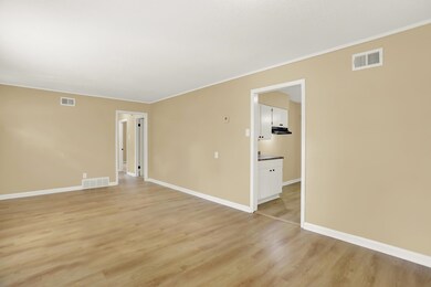 Empty room with light hardwood / wood-style floori