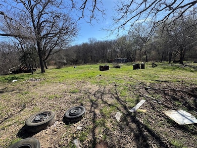 View of yard featuring a view of trees