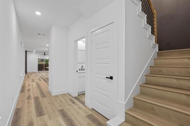 Stairs featuring light hardwood / wood-style floor