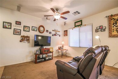 Great room features ceiling fan and surround sound