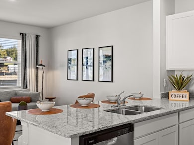 Pearson kitchen open to the living and dining area