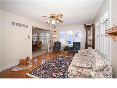 Hardwood floors & many windows add to the charm