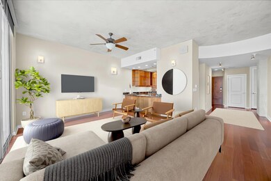 Living room featuring baseboards, visible vents, 