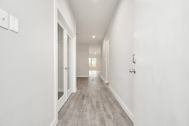 The grand entrance beckons with high ceilings, ado