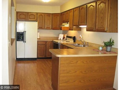 Kitchen with raised-panel oak cabinets.