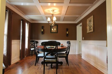 Formal dining room with views of front yard. This room is off entry foyer and next to kitchen. 