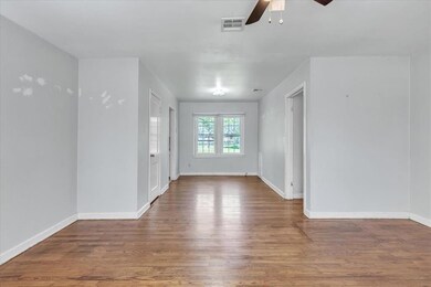 Unfurnished room with hardwood / wood-style floori