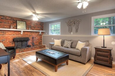 Lower level family room - full brick wall with rai