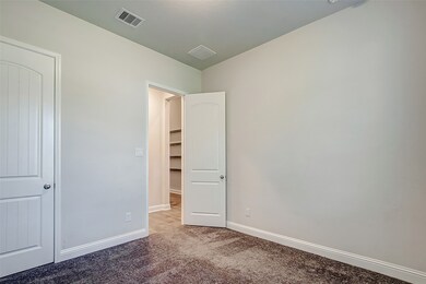 One of the large secondary bedrooms.
