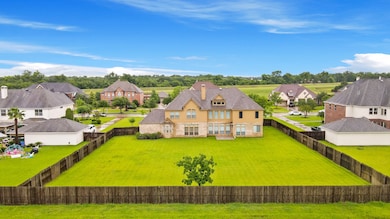 It features a large fenced backyard, perfect for o
