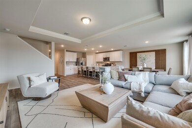 Bright gathering room *Photos of furnished model. Not actual home. Representative of floor plan. Some options and features may vary