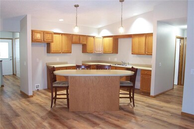 New Lifeproof Luxury Vinyl Plank flooring installed throughout main level (no transitions and waterproof). New lighting, freshly painted interior including ceilings. Notice dramatic vaulted ceilings! Open floor plan! Very neat and clean. Move in ready!